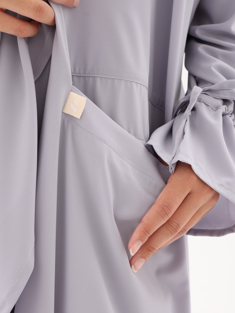 Side pocket and drawstring cuff detail in mist grey