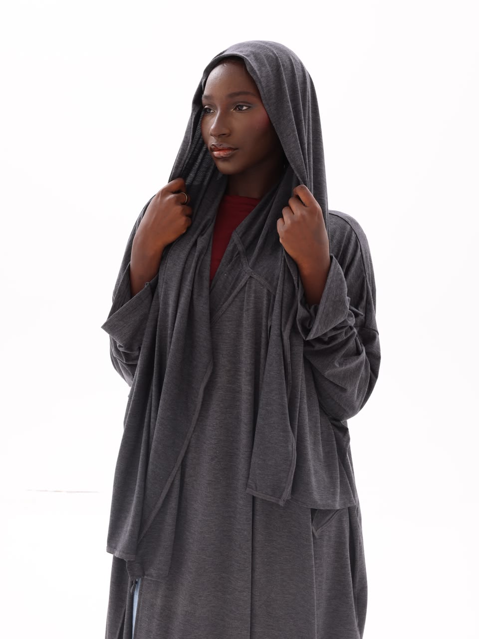 Close-up of the charcoal hooded jersey drape